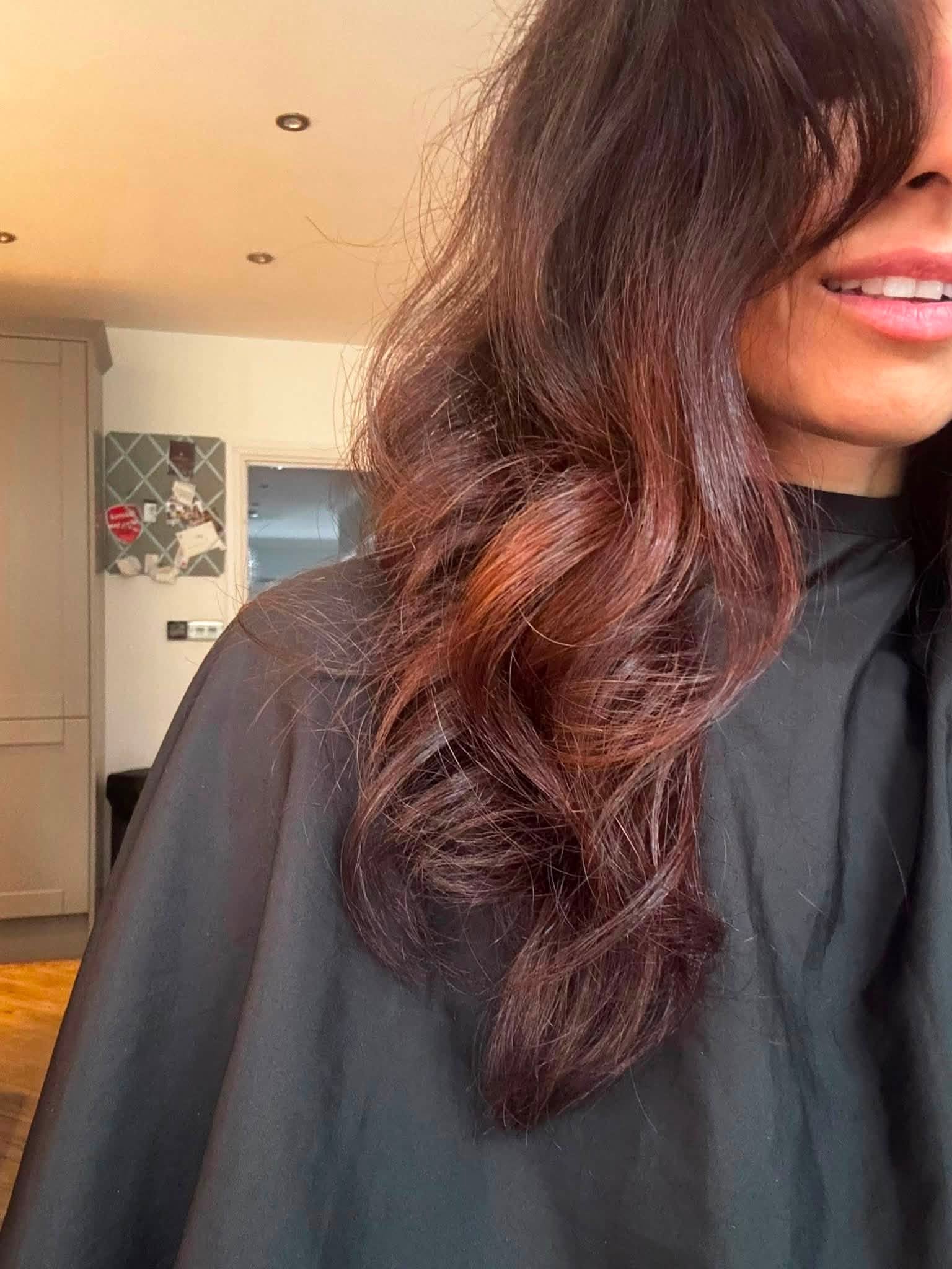 Long auburn hair with loose waves