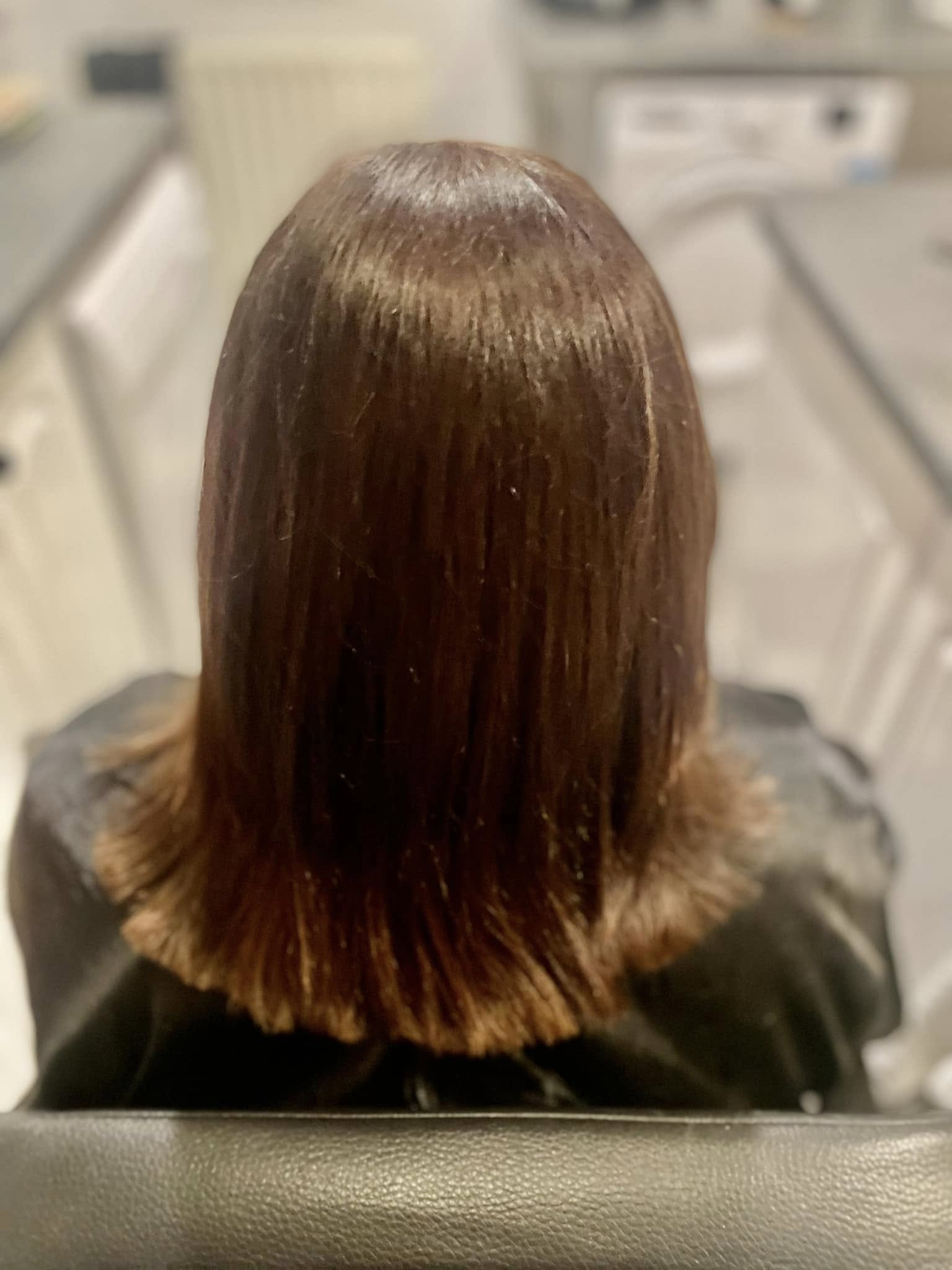 Glossy shoulder-length chestnut hair